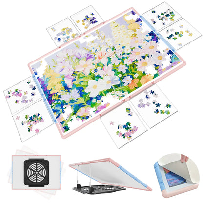 Bjpuzt 2000 piece revolving puzzle board in pink and blue, shown with its eight transparent sorting boxes, 360-degree rotation, and adjustable tilt stand.