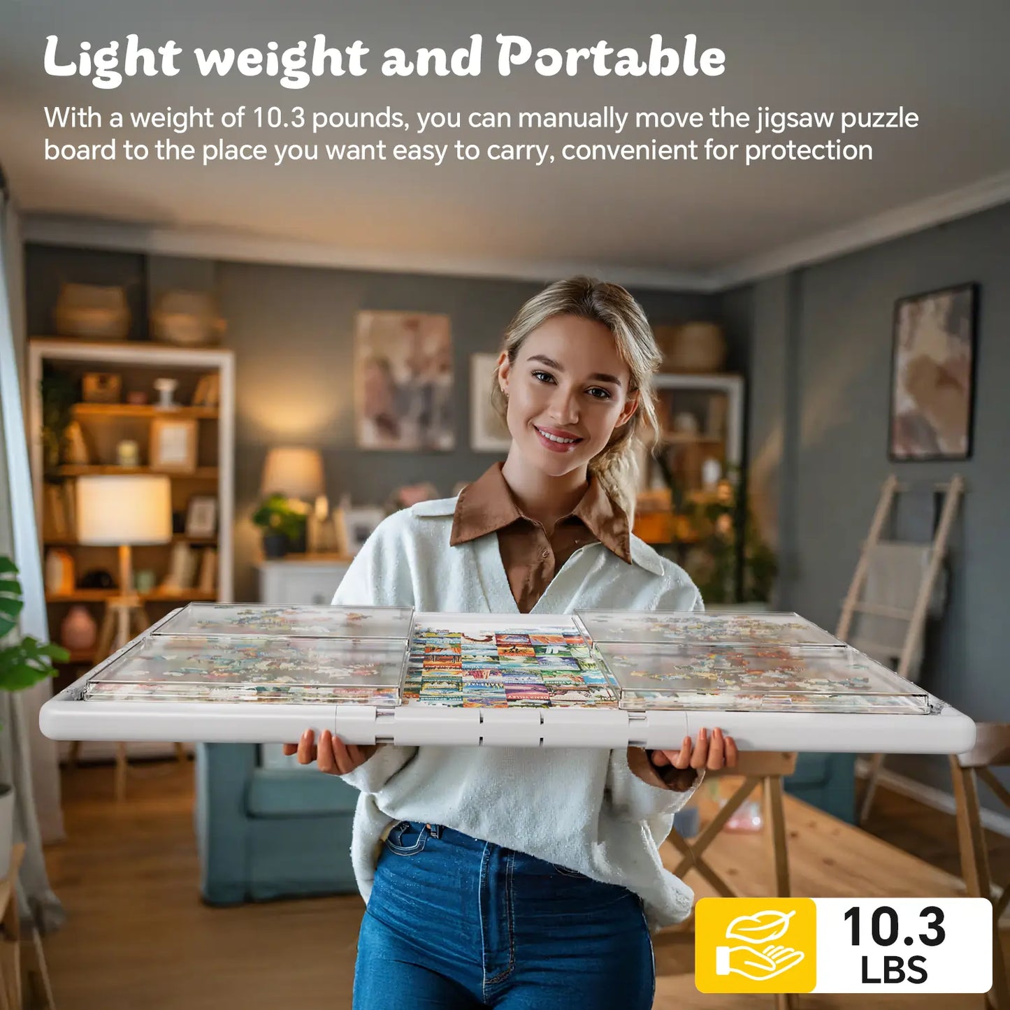 A smiling woman easily carrying the lightweight and portable gray puzzle board, demonstrating its convenience for moving and storage.