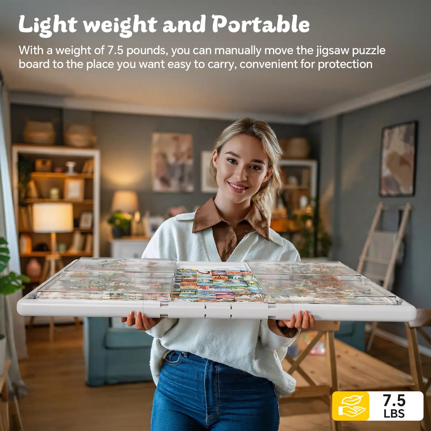 A smiling woman easily carrying the lightweight and portable grey puzzle board, which weighs only 7.5 lbs, through her living room.